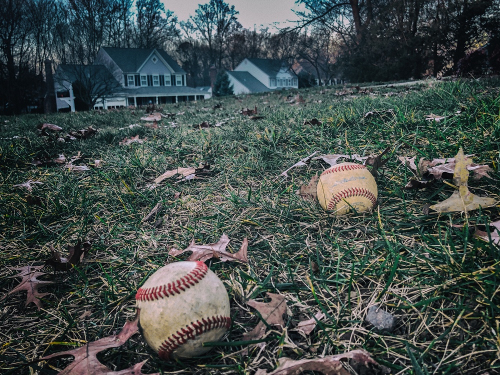 baseballs on lawn